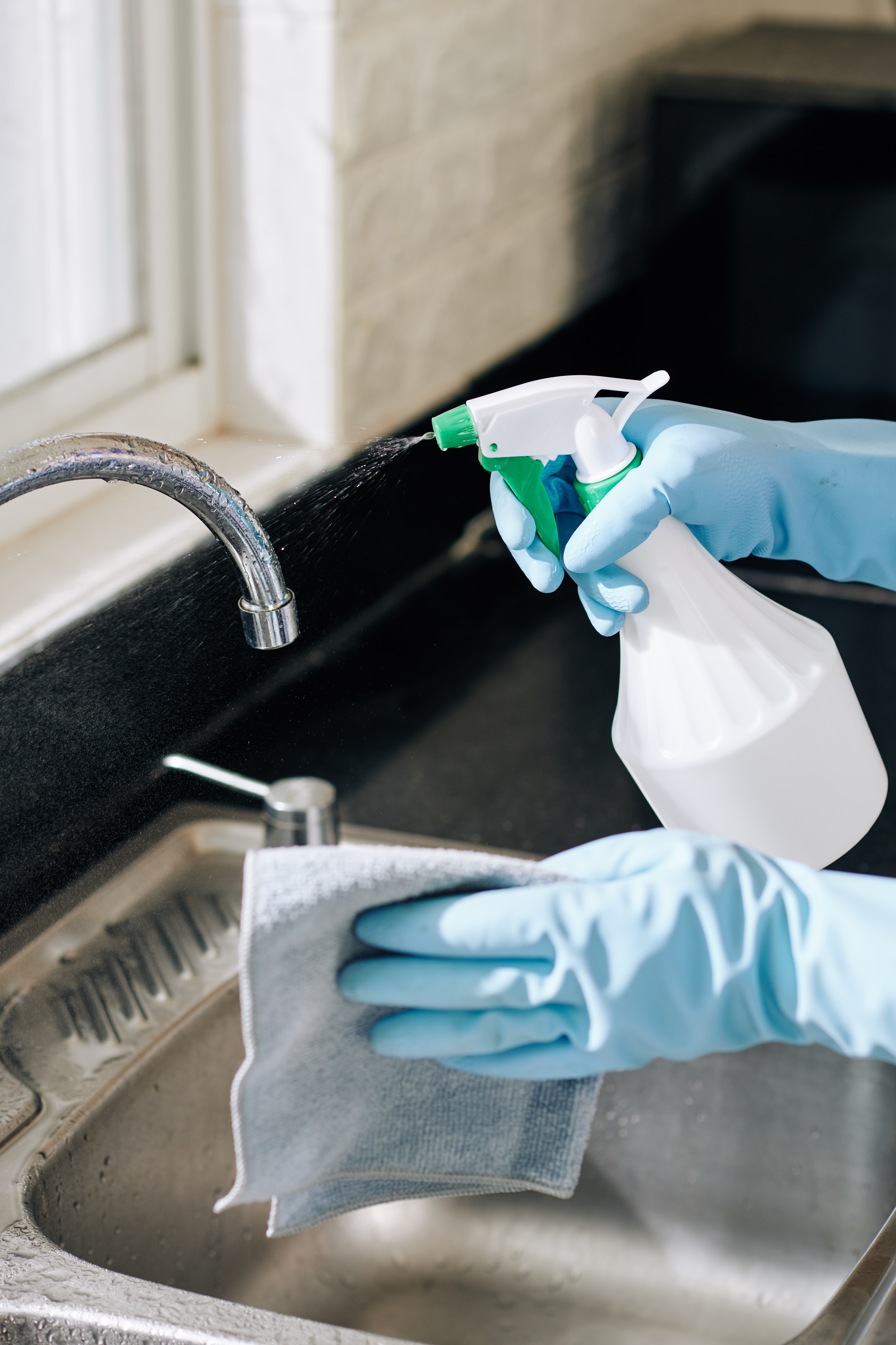 housewife cleaning kitchen tap 2023 11 27 05 12 27 utc